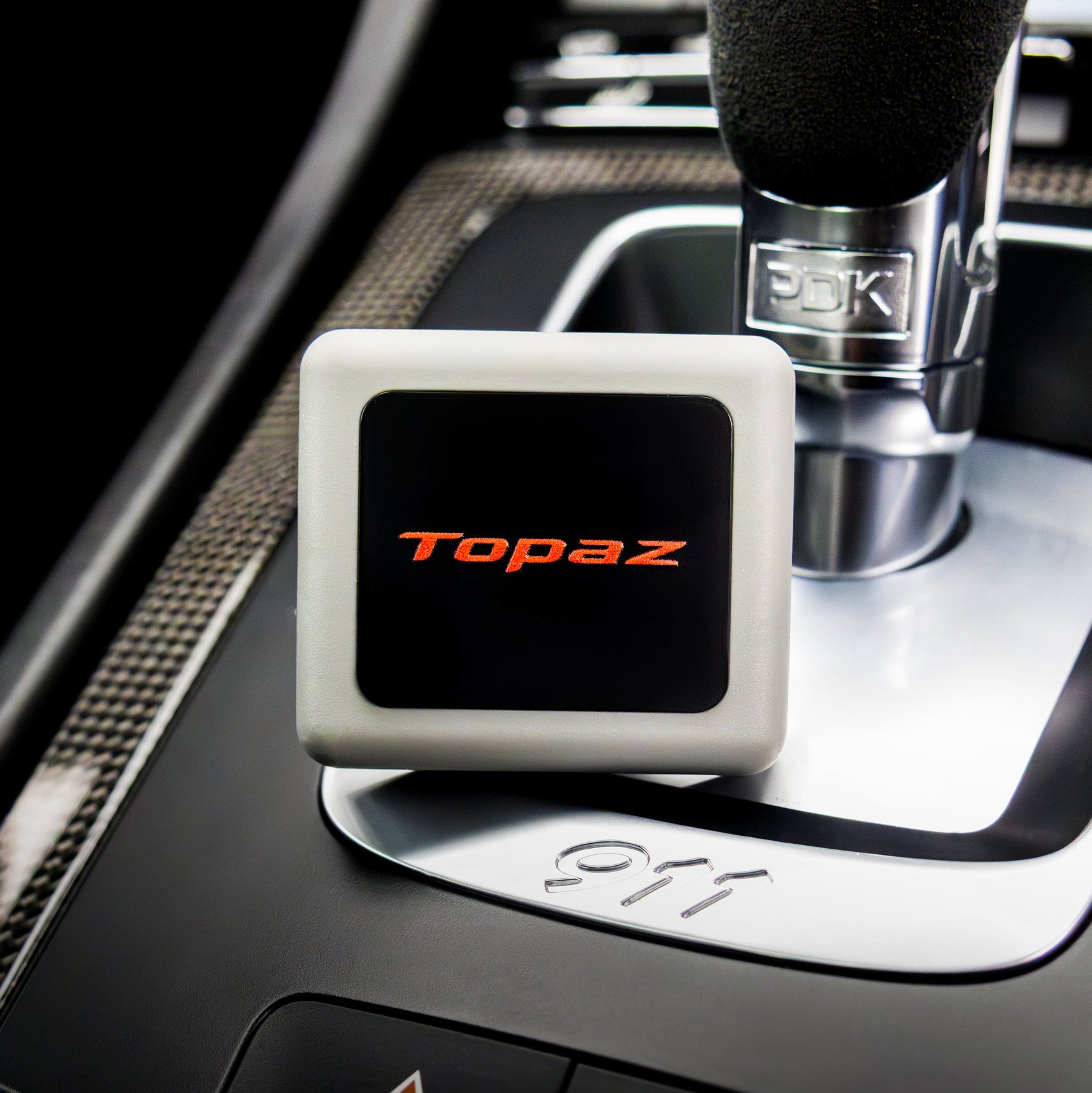 Topaz Square Classic Black Smoke Oud air freshener clipped on a car vent