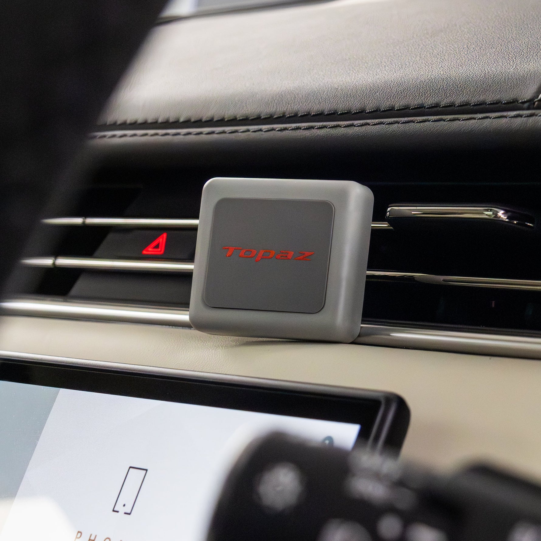 Topaz Square Classic Grey Rose Oud air freshener inside a car